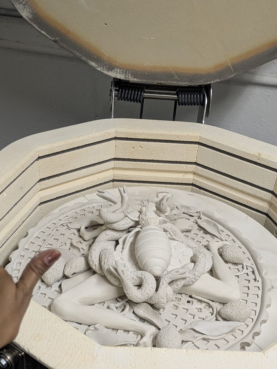 Ceramic pieces resting in the kiln