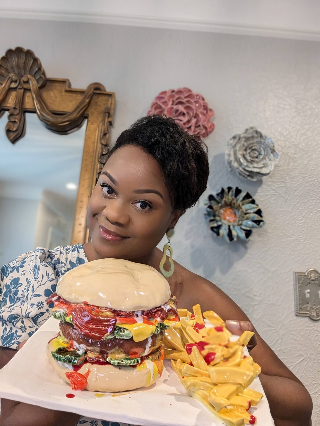 Sculptural ceramic burger and fries piece, closeup