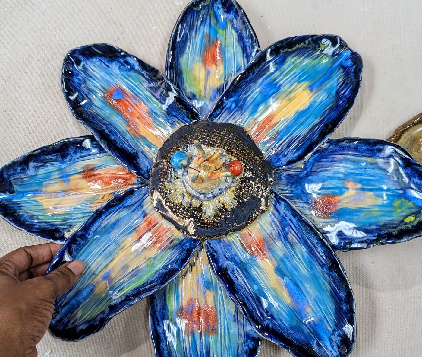 Handbuilt ceramic blue and gold flower