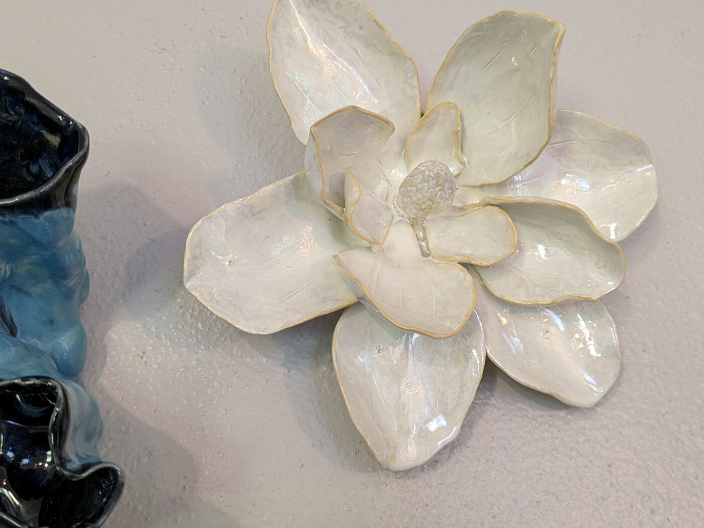 Handbuilt ceramic splatter-glaze wall flower