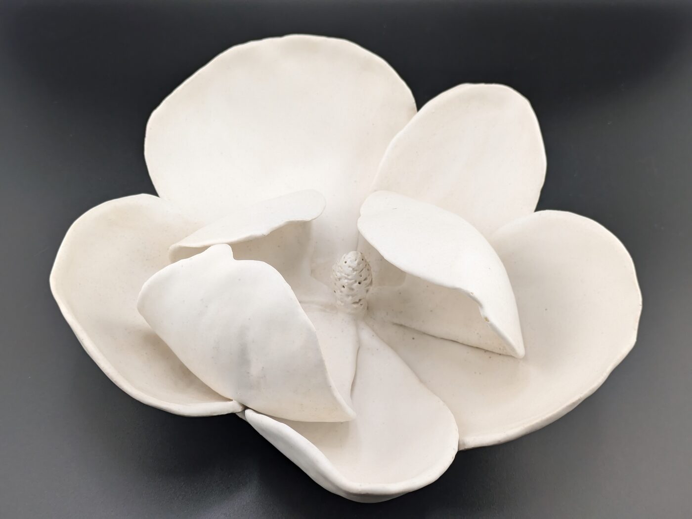 Handbuilt ceramic magnolia closeup